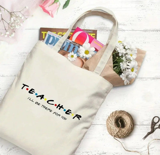 Teacher Öğretmenler tasarımlı %100 pamuk ham bez çanta. 35x40 cm dayanıklı, çevre dostu, günlük kullanım ve hediye için ideal tote bag modeli.