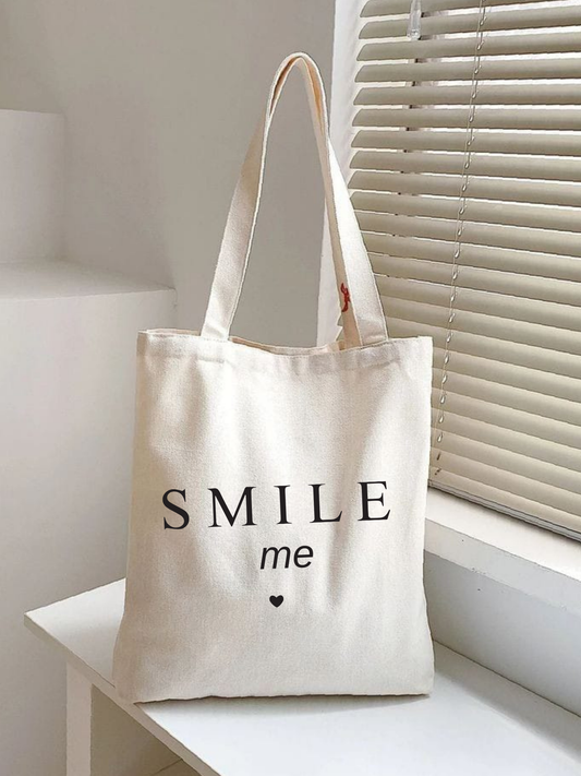 Smile Me tasarımlı %100 pamuk ham bez çanta. 35x40 cm dayanıklı, çevre dostu, günlük kullanım ve hediye için ideal tote bag modeli.